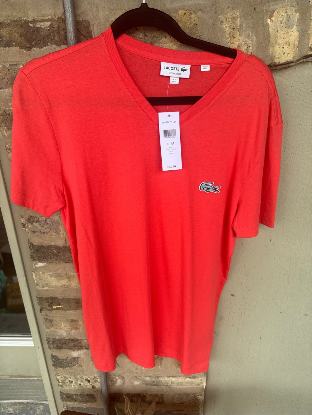 Lacoste Men’s V-Neck Tee in Coral
